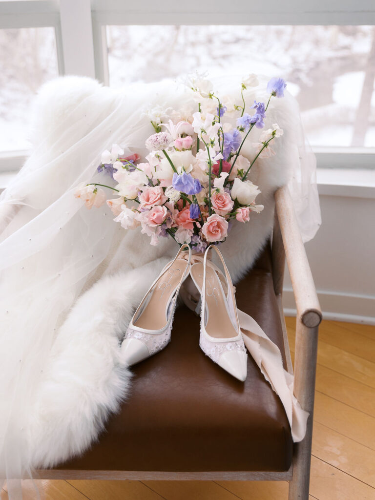 bride shoes and bouquet detail Michigan Micro-wedding on film in falling snow, Fennville MI