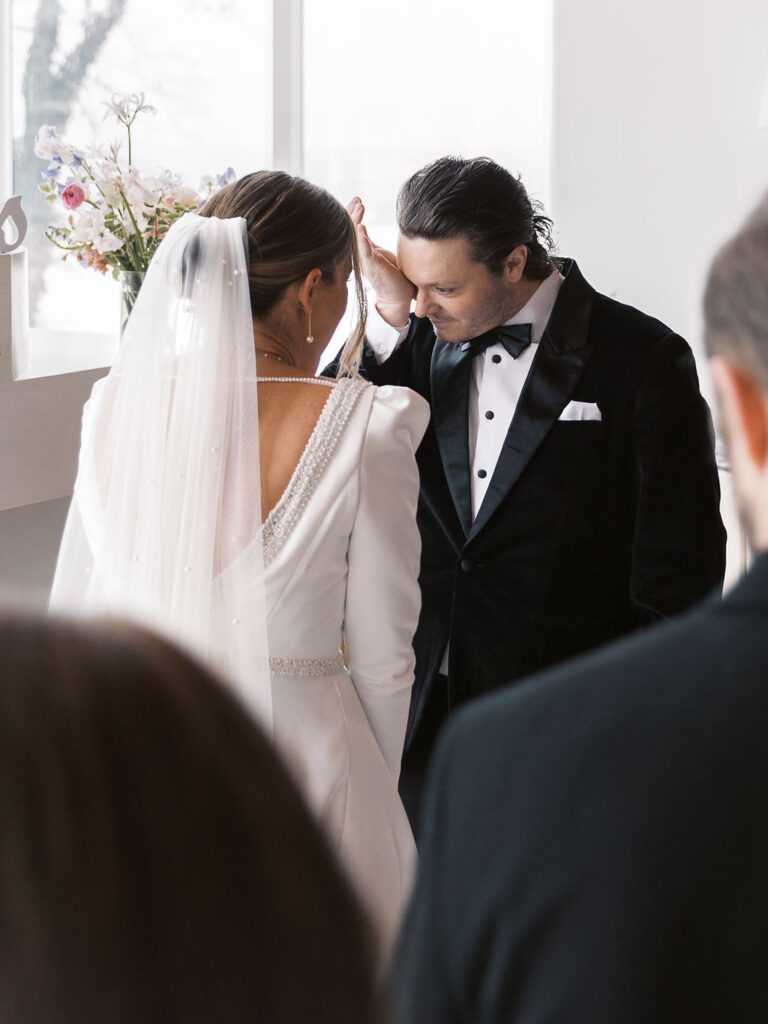 emotional ceremony Michigan Micro-wedding on film in falling snow, Fennville MI