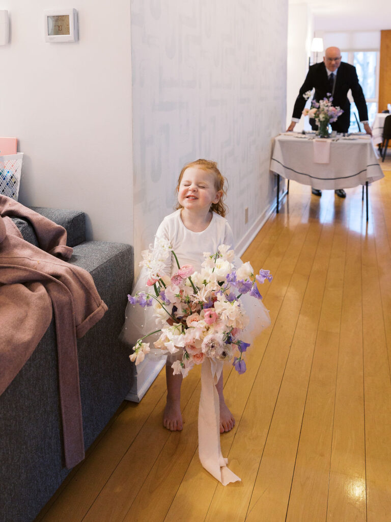 Final snowy portrait outside holding hands, winter micro-wedding film shot