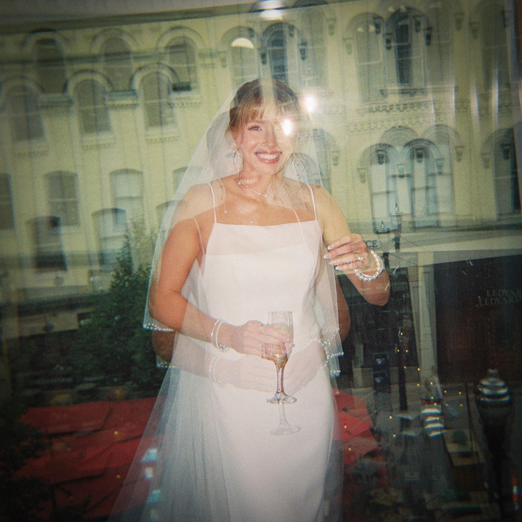 Elevated wedding party portrait in front of the Grand Rapids Art Museum steps