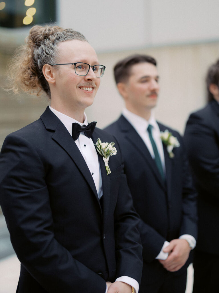 wedding the Grand Rapids Art Museum with clean architectural lines in the background on 35mm film