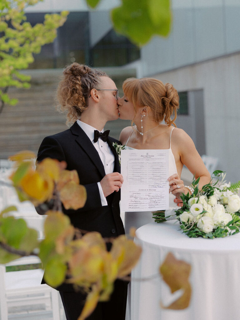 wedding the Grand Rapids Art Museum with clean architectural lines in the background on 35mm film