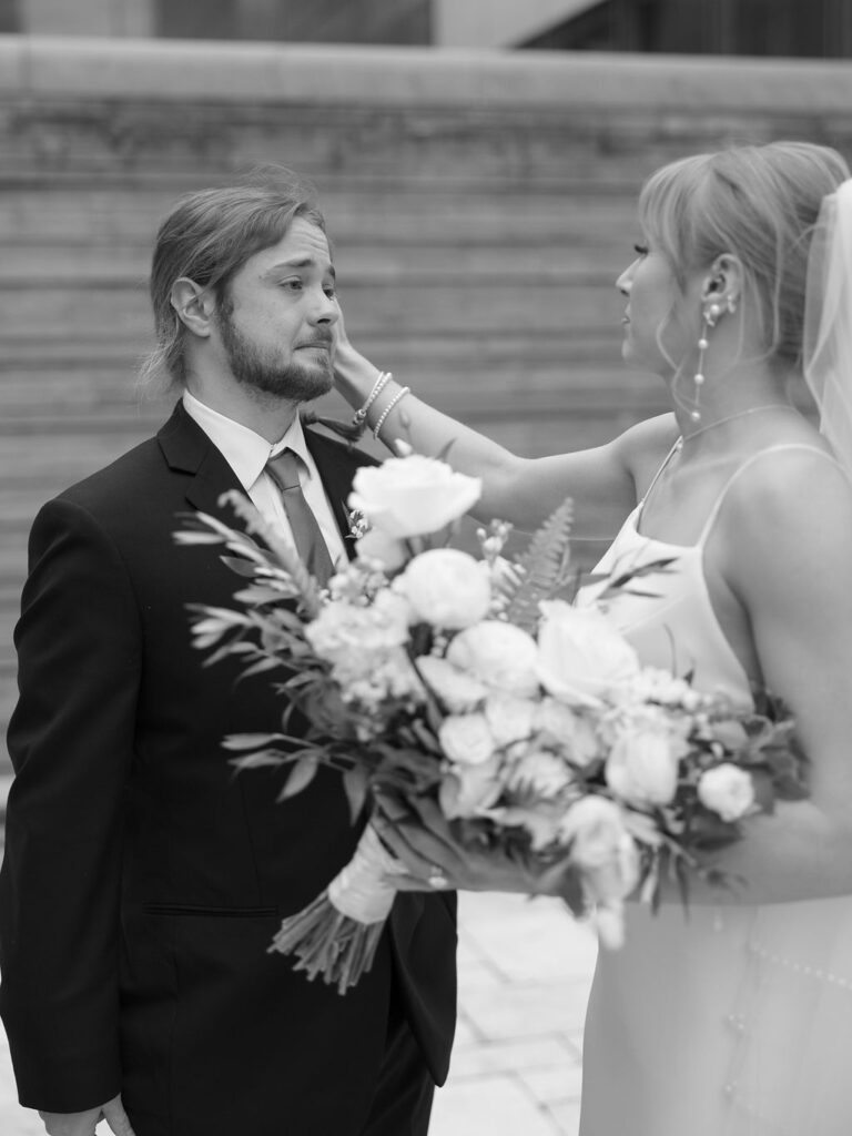 Elevated wedding party portrait in front of the Grand Rapids Art Museum steps