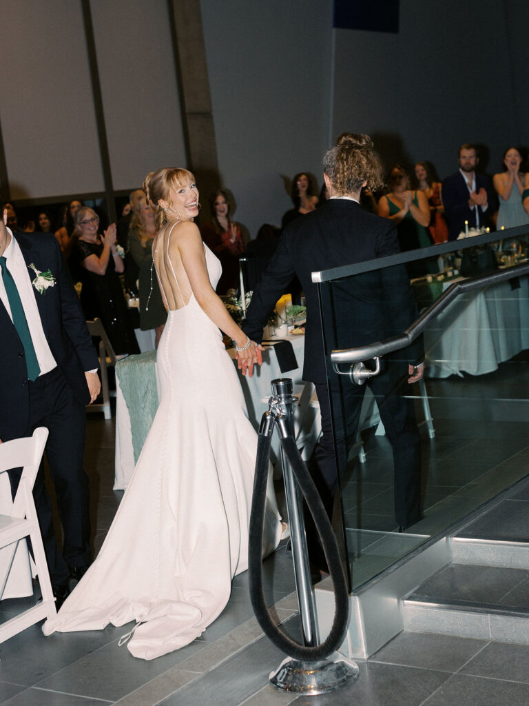 wedding the Grand Rapids Art Museum with clean architectural lines in the background on 35mm film