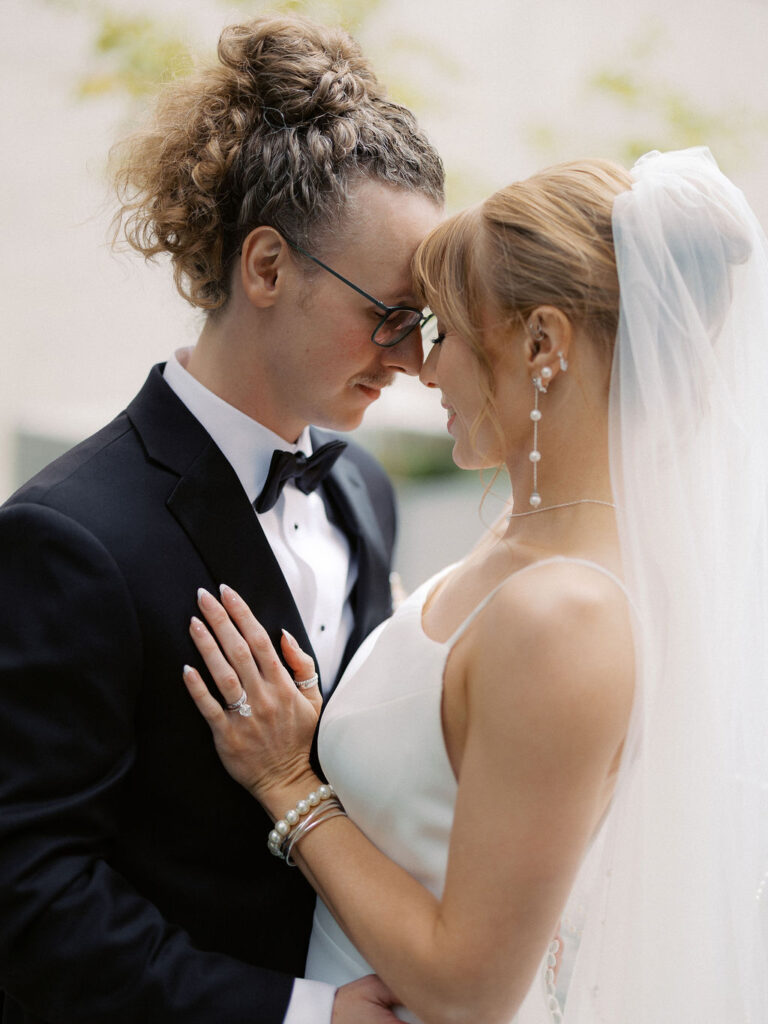Elevated wedding party portrait in front of the Grand Rapids Art Museum steps
