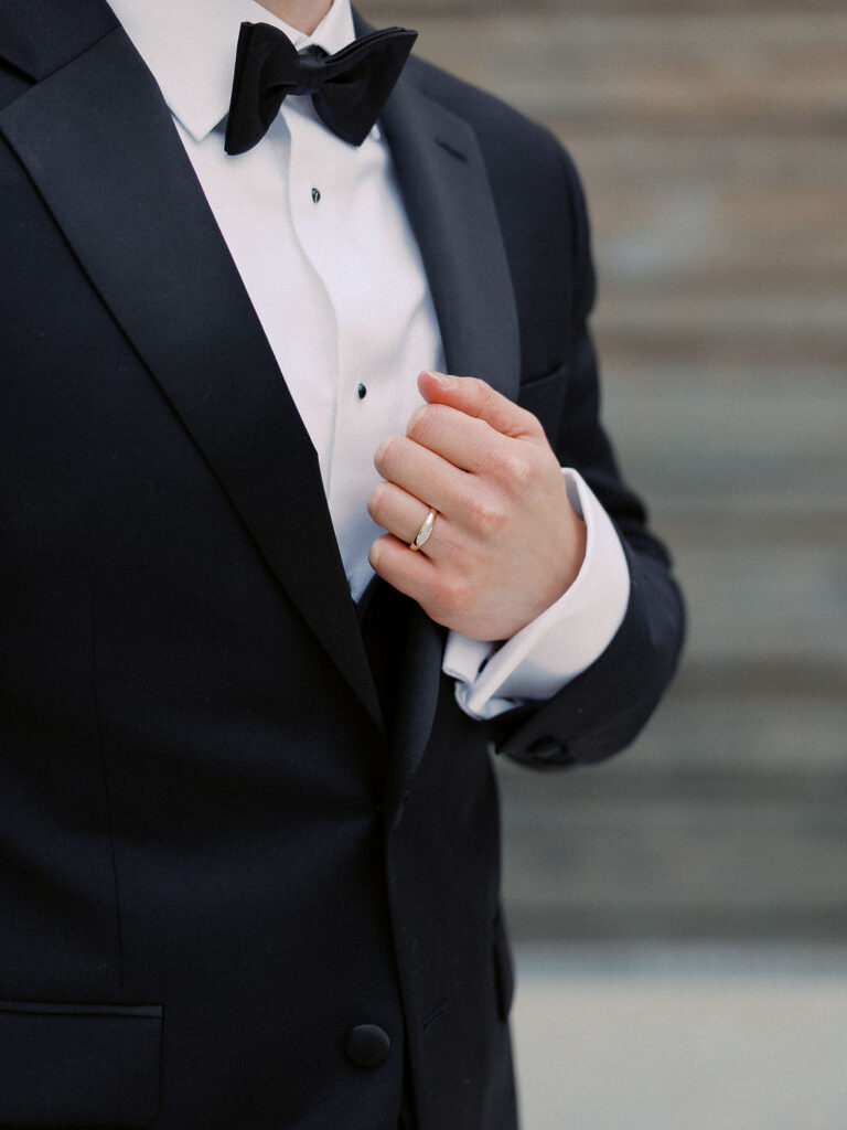 Elevated wedding party portrait in front of the Grand Rapids Art Museum steps