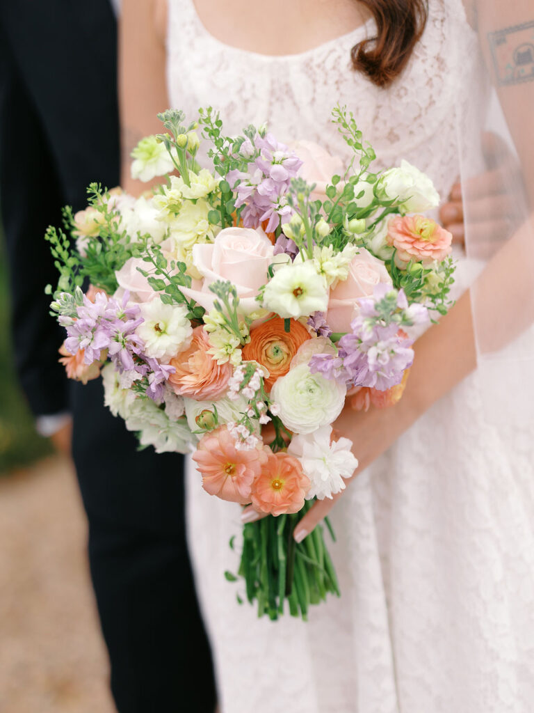 Of the Land Wedding Photos in Michigan on film, joyful celebration with lush florals and bride and groom laughing