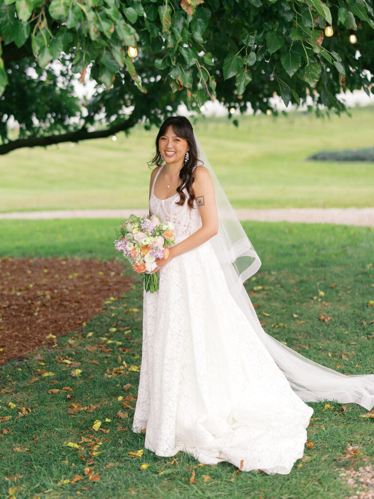 Of the Land Wedding Photos in Michigan on film, joyful celebration with lush florals and bride and groom laughing