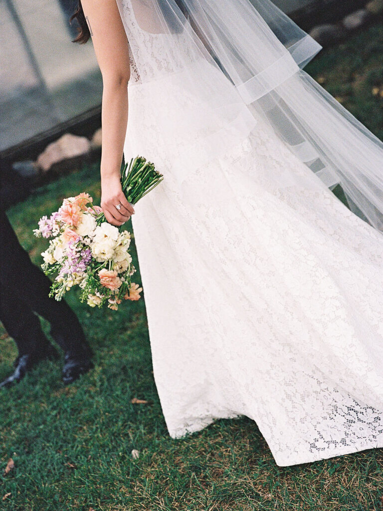 Of the Land Wedding Photos in Michigan on film, joyful celebration with lush florals and bride and groom laughing