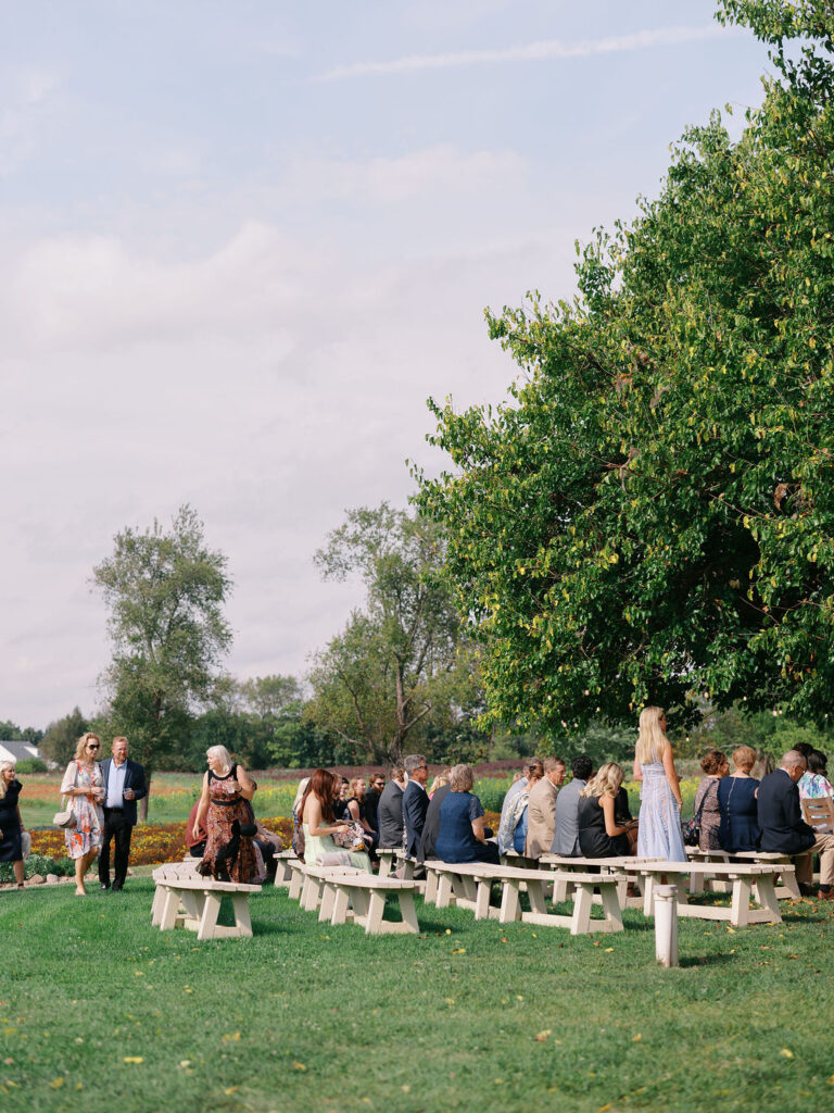 Of the Land Wedding Photos in Michigan on film, joyful celebration with lush florals and bride and groom laughing