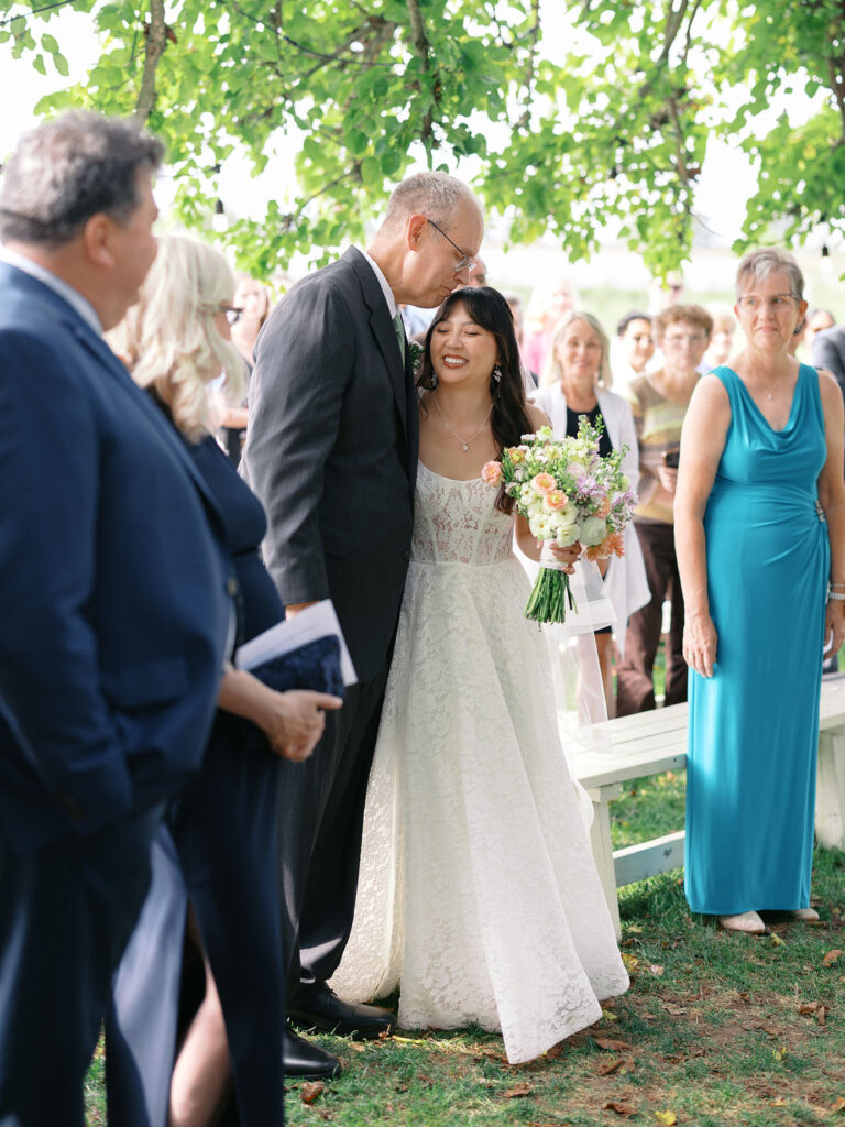 Of the Land Wedding Photos in Michigan on film, joyful celebration with lush florals and bride and groom laughing