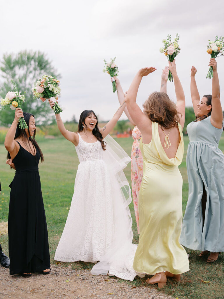 Of the Land Wedding Photos in Michigan on film, joyful celebration with lush florals and bride and groom laughing
