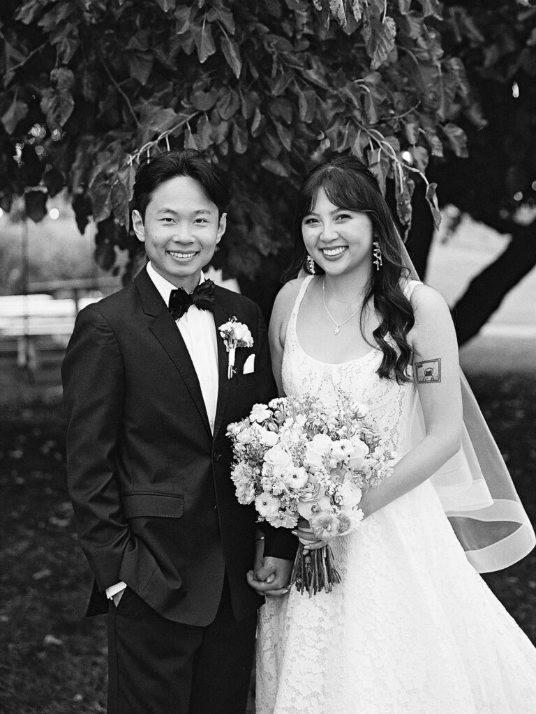 Of the Land Wedding Photos in Michigan on film, joyful celebration with lush florals and bride and groom laughing