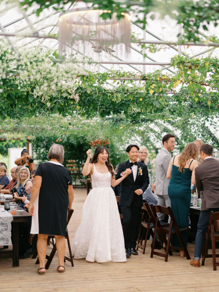 Of the Land Wedding Photos in Michigan on film, joyful celebration with lush florals and bride and groom laughing