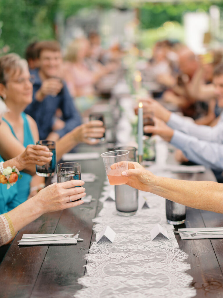 Of the Land Wedding Photos in Michigan on film, joyful celebration with lush florals and bride and groom laughing