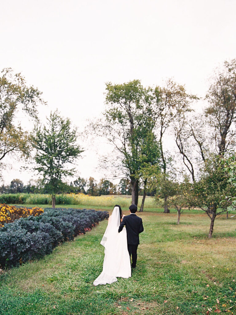 Of the Land Wedding Photos in Michigan on film, joyful celebration with lush florals and bride and groom laughing