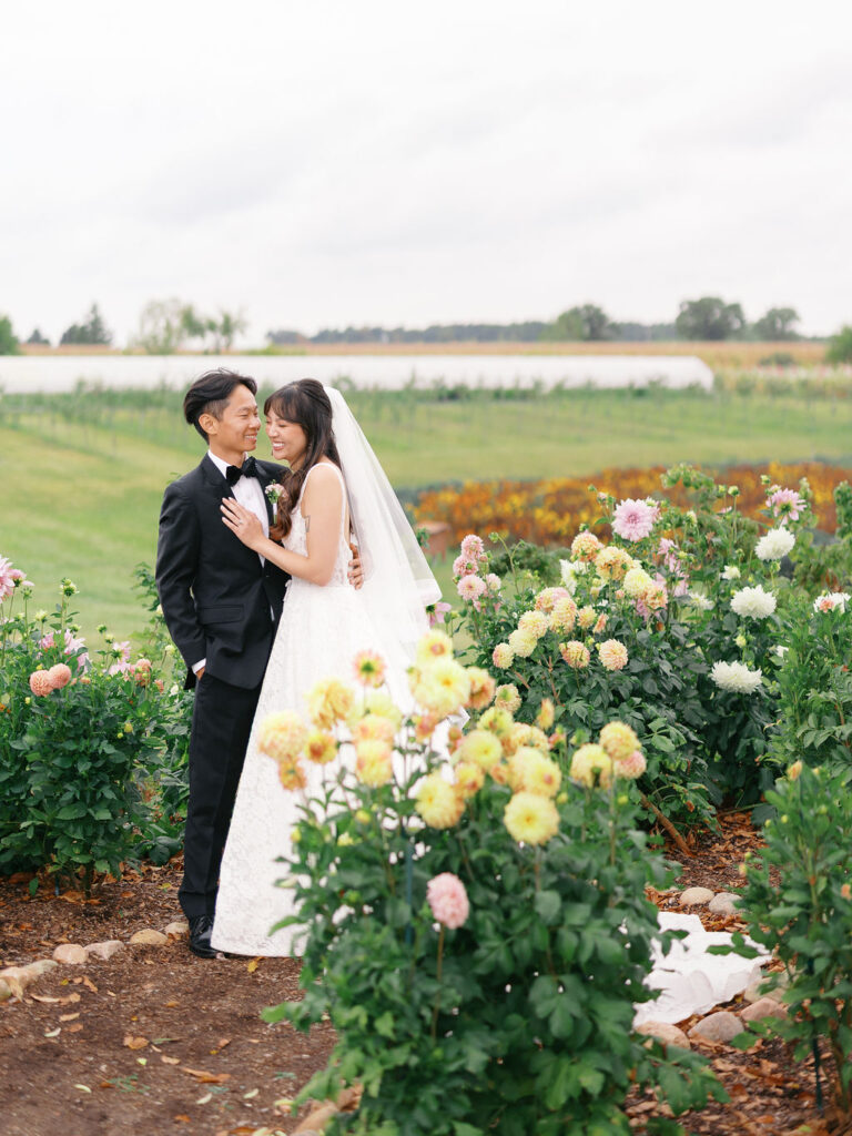 Of the Land Wedding Photos in Michigan on film, joyful celebration with lush florals and bride and groom laughing