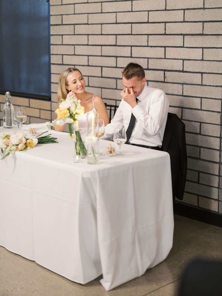 Reception tablescape with elegant florals and accented greenery at Port 393