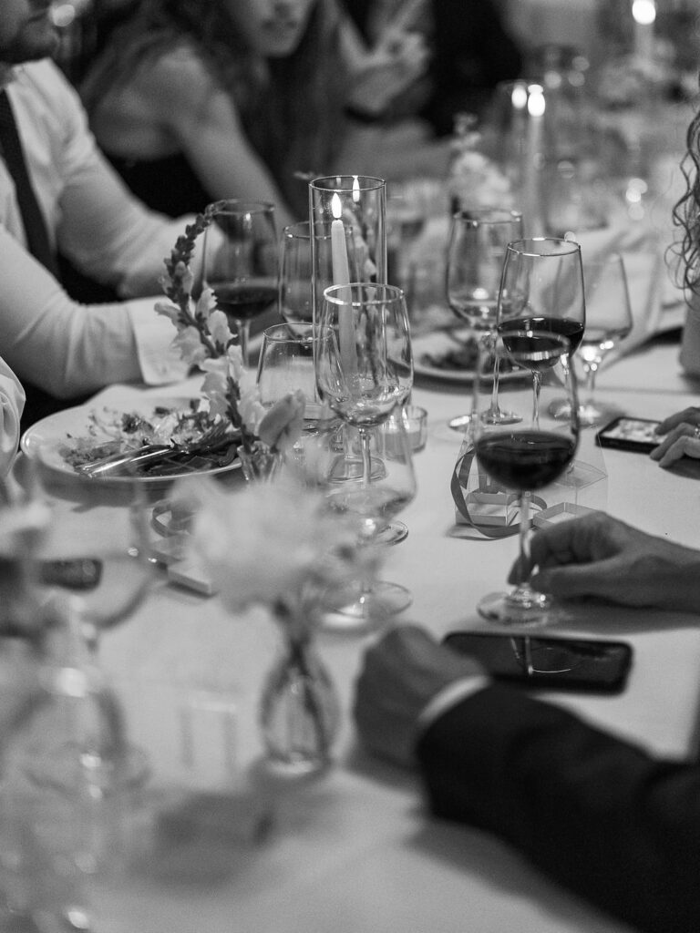 Reception tablescape with elegant florals and accented greenery at Port 393