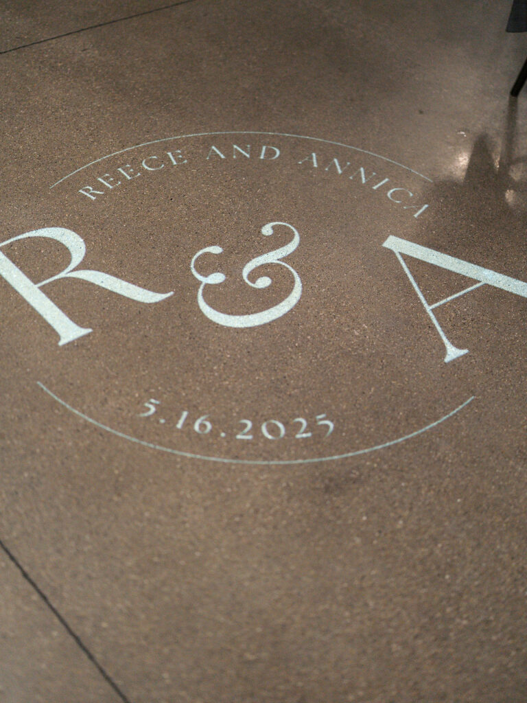 Reception tablescape with elegant florals and accented greenery at Port 393