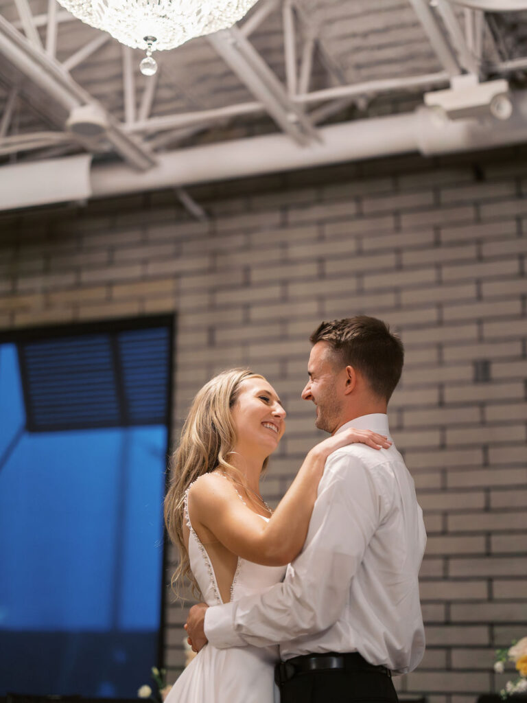 Bride and groom smiling in the sunshine outside Port 393 on 35mm film