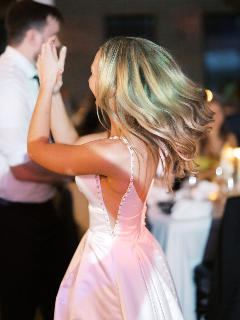 Reception tablescape with elegant florals and accented greenery at Port 393