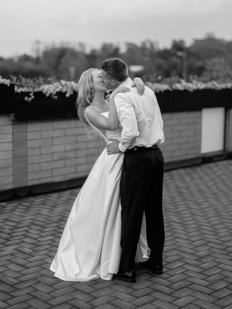 Bride and groom smiling in the sunshine outside Port 393 on 35mm film