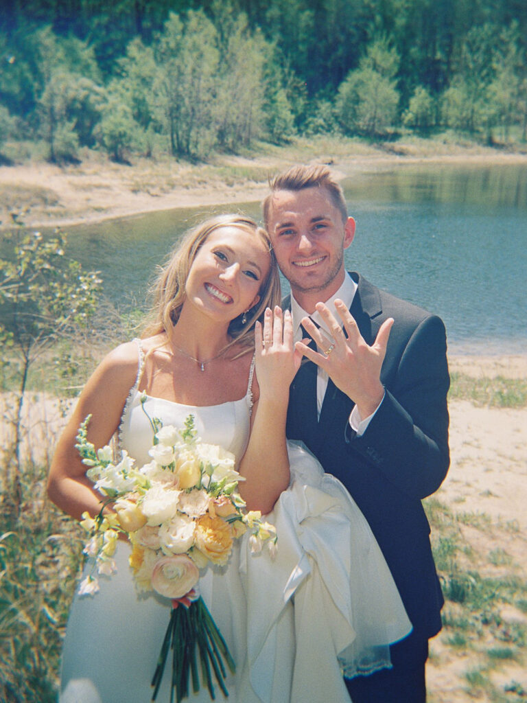 Bride and groom smiling in the sunshine outside Port 393 on 35mm film