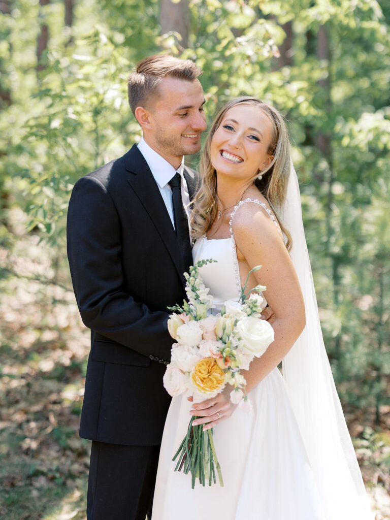 Bride and groom smiling in the sunshine outside Port 393 on 35mm film