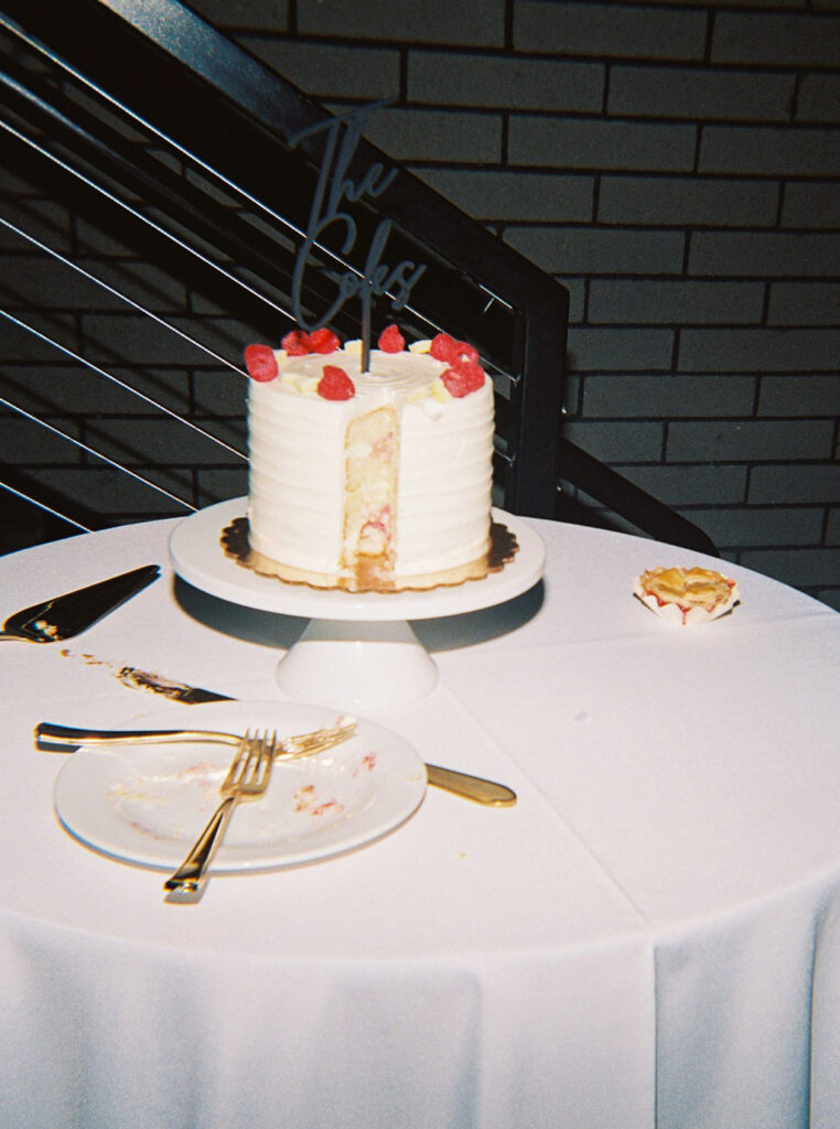 Reception tablescape with elegant florals and accented greenery at Port 393