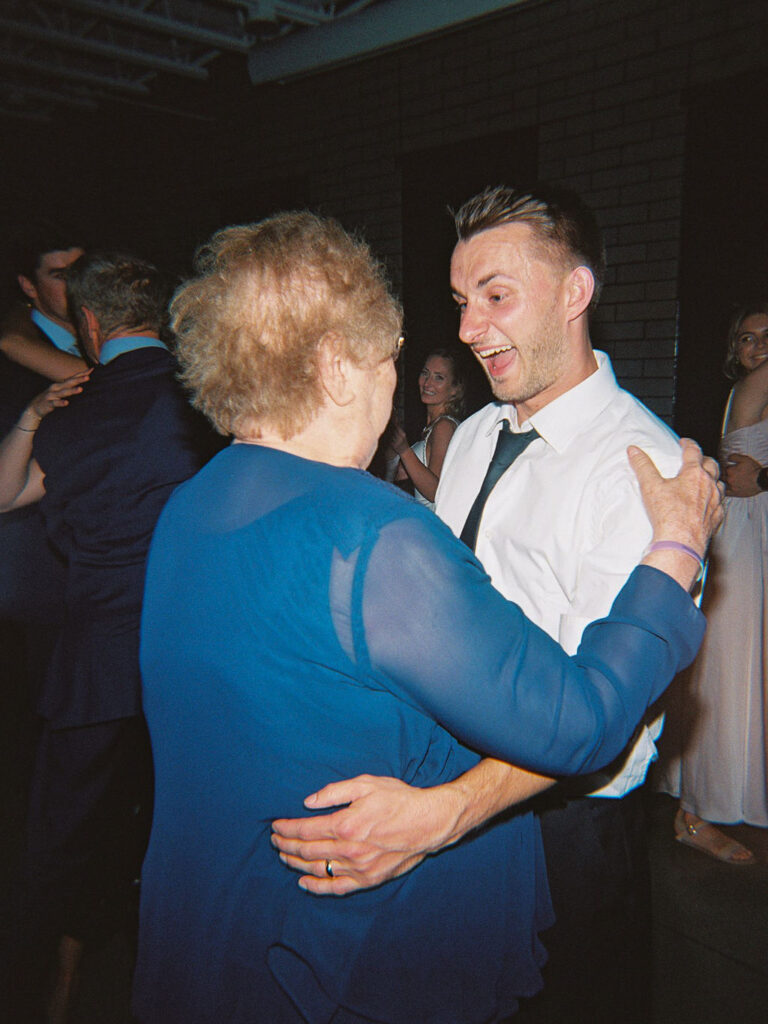 Reception tablescape with elegant florals and accented greenery at Port 393