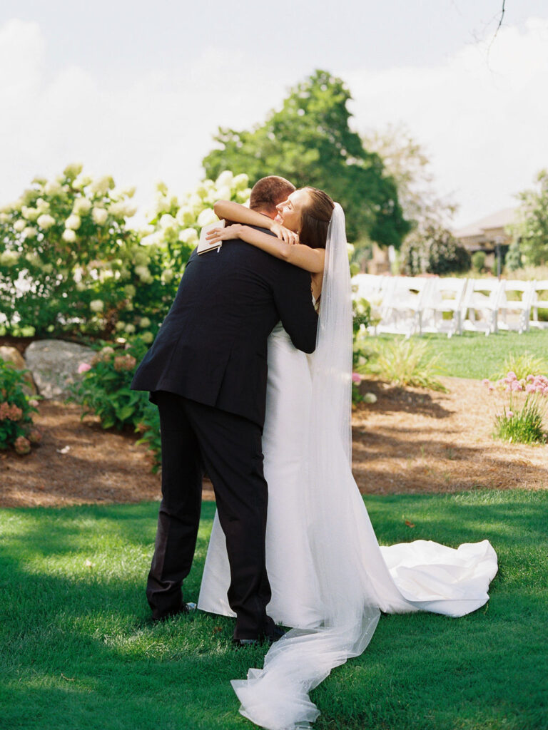 Outdoor ceremony at The Union Pavilion at Railside with soft romantic florals and greenery on film