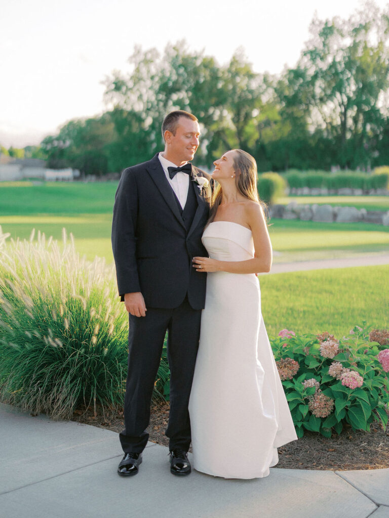 bride and groom portrait at The Union Pavilion at Railside with soft romantic florals and greenery on film