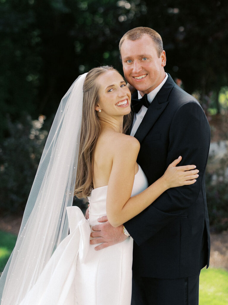 bride and groom portrait at The Union Pavilion at Railside with soft romantic florals and greenery on film
