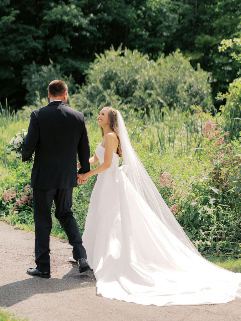 bride and groom portrait at The Union Pavilion at Railside with soft romantic florals and greenery on film