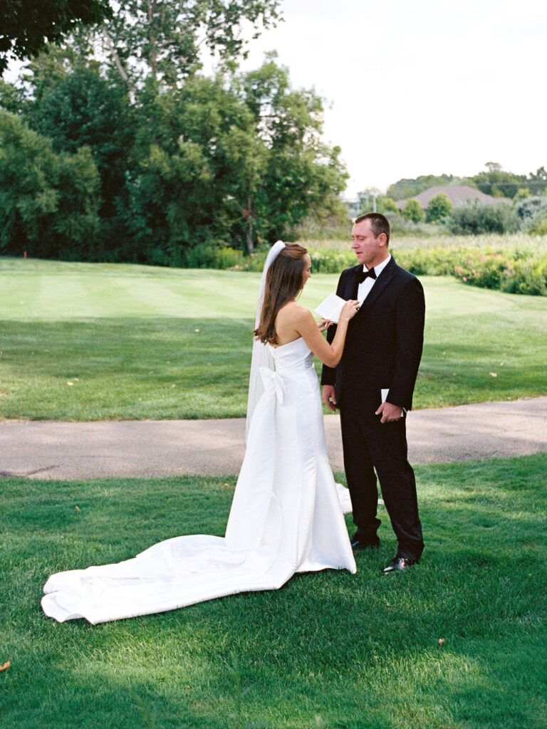 Outdoor ceremony at The Union Pavilion at Railside with soft romantic florals and greenery on film
